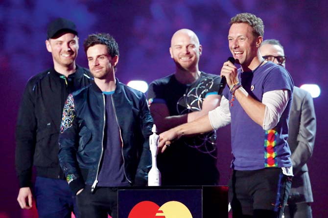 Members of Coldplay at an award ceremony in London. Pic/AFP