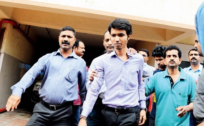 Thane Crime Branch officers escort staffers of Universal Outsourcing Services, the call centre in Mira Road that was raided yesterday. Pics/Pramod Dethe