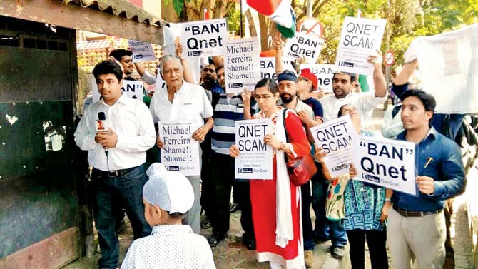 Those who were duped by QNet, outside Michael Ferreira’s home in Bandra this April. File pics