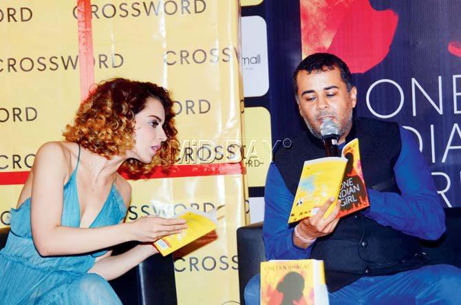 Kangana Ranaut looks enquires about a section of Chetan Bhagat’s book at its launch at a suburban mall over the weekend. Pic/Sneha Kharabe