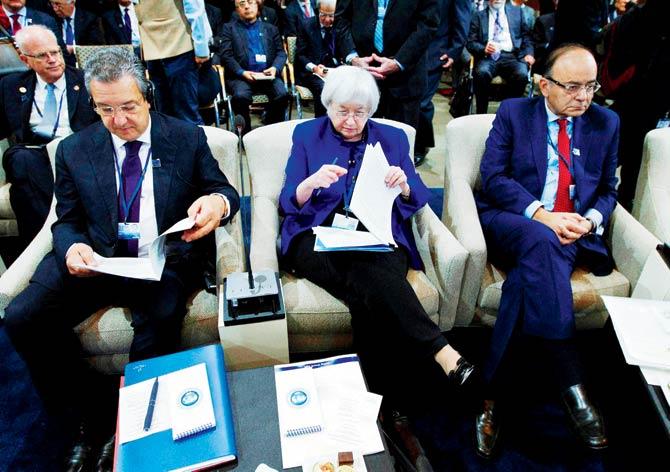 From left, Algeria’s Bank Governor Mohamed Loukal, Federal Reserve Chair Janet Yellen and India Finance Minister Arun Jaitley during the International Monetary and Financial Committee (IMFC) conference at World Bank/IMF Annual Meetings at IMF headquarters in Washington. Pic/AP/PTI