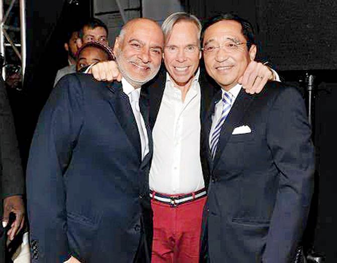 (L) Mohan Murjani with Tommy Hilfiger and a friend
