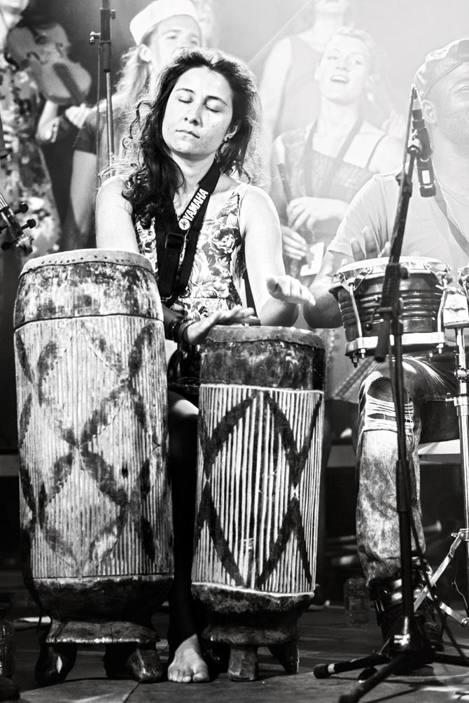 Monserrat ‘Mona’ Vasquez plays the Andean bombo (brass drums)