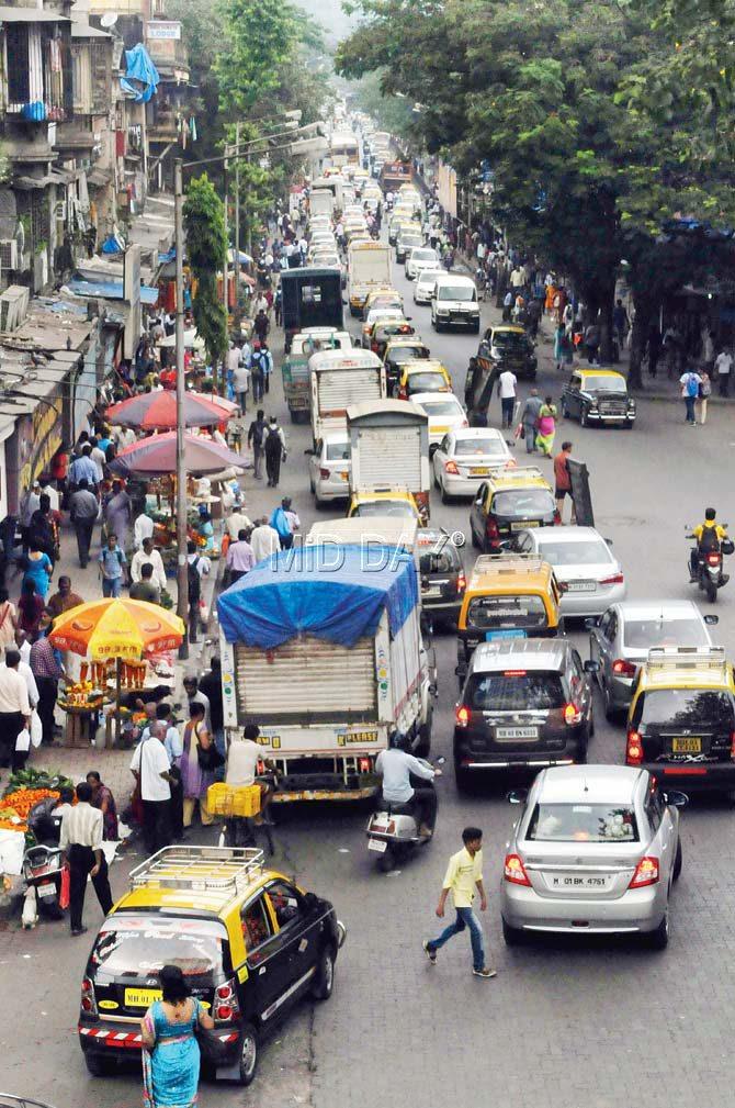 Motorists and pedestrians jostle for space near the ward office at Parel junction