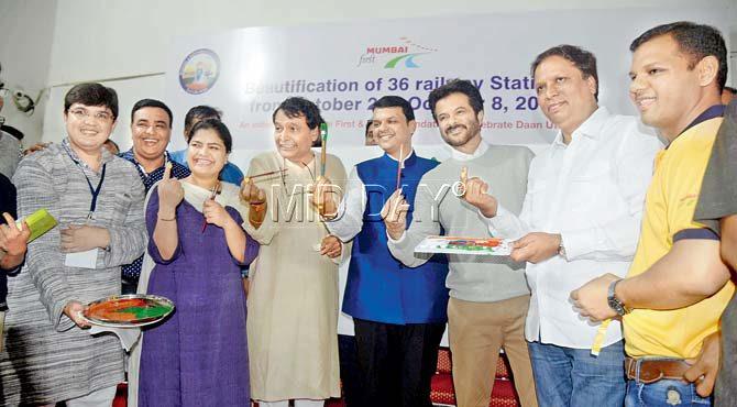 (Second from left onwards) BJP MP Poonam Mahajan, Railway Minister Suresh Prabhu, Chief Minister Devendra Fadnavis, Bollywood actor Anil Kapoor and president of BJP’s city unit Ashish Shelar during the announcement of the CSR initiative Chakachak Mumbai, at Bandra station on Sunday. Pic/Datta Kumbhar