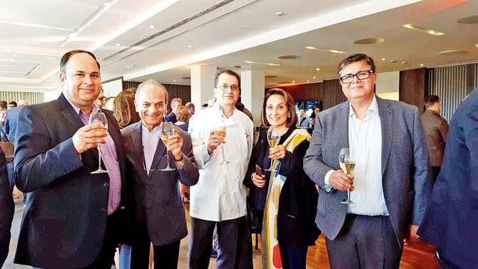 Ranjit Mathrani (second from left) and Namita Panjabi with Michelin Guide officials
