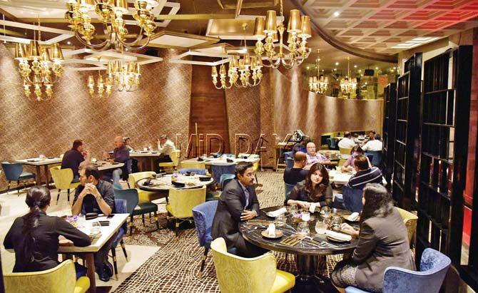 The 52-seater space is dotted with tables, made of Italian marble and the walls are plastered with Mediterranean mosaic tiles; (left) Australian chef Martin Kindleysides says he’s still trying to understand the Mumbaikar’s palate. Pics/Shadab Khan