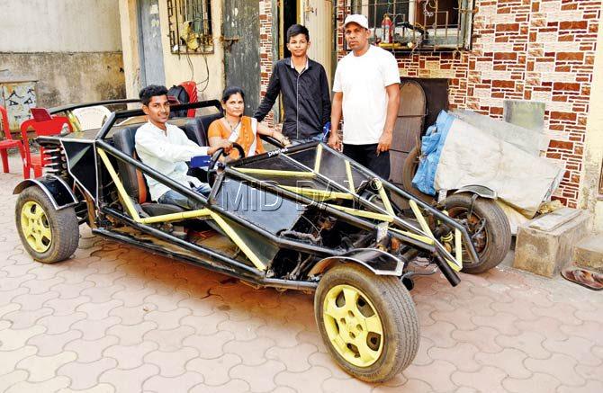 The car gives an average of 6 kilometres per litre and has a top speed of 180 kmph. “But I hardly cross 80, as I follow the rules,” says Prem Thakur, seen here in the driver’s seat, with his parents and younger brother. Pic/Pradeep Dhivar