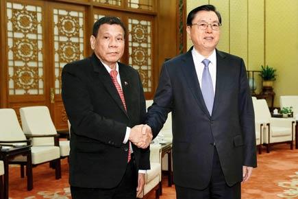Philippines president meets Xi, declares 'separation' from US