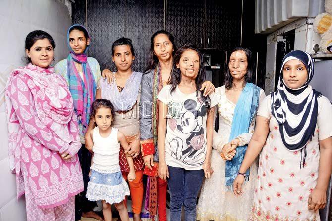 Shabho Sheikh (fifth from left) alleged that the Legal Services Authority demanded a bribe of Rs 50,000 to clear her documents. Pic/Sneha KharabeShabho Sheikh (fifth from left) alleged that the Legal Services Authority demanded a bribe of Rs 50,000 to clear her documents. Pic/Sneha Kharabe