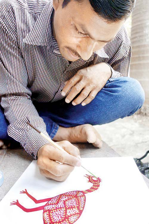 Bhil artist Sher Singh at work