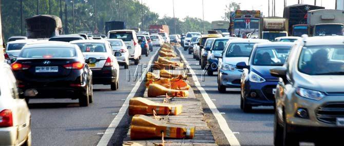 The dividers are meant to help manage the traffic but more than 100 of these dividers along the stretch are damaged and even broken at some places. Pic/Nimesh Dave