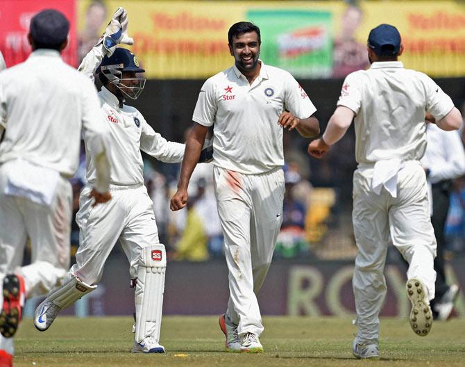 R Ashwin celebrates a wicket with teammates