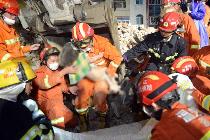 China building collapse, child rescued