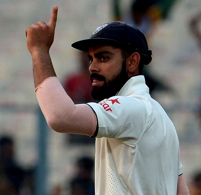 Team India captain Virat Kohli gestures after victory on the fourth day of the second Test match between India and New Zealand at The Eden Gardens Cricket Stadium in Kolkata on Monday. Pic/AFP 