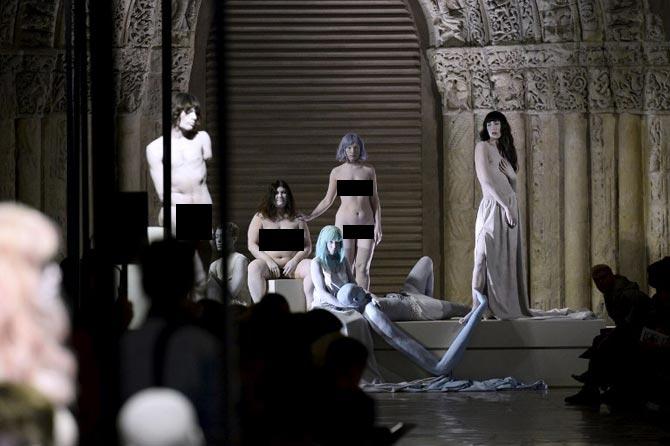 Models, who were near naked and completely nude, posed as part of an art performance for the set of the Kenzo 2017 Spring/Summer ready-to-wear collection fashion show in Paris