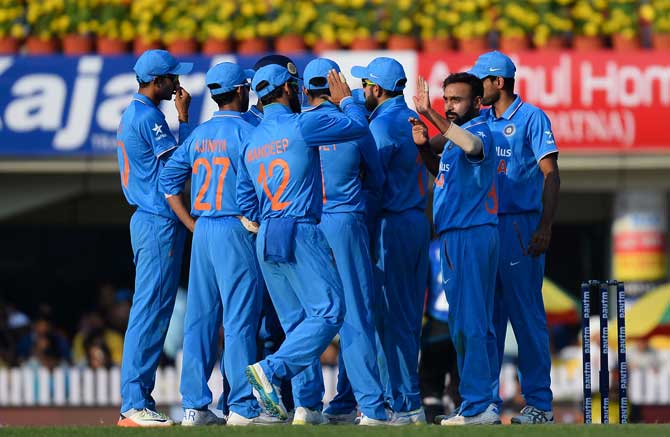 Team India celebrates the fall of a Kiwi wicket 