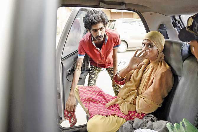 Chanda Rawal with her son Sunny staying in Indica Car from last eight months at Charkop Kandivali. Pic/ Pradeep Dhivar