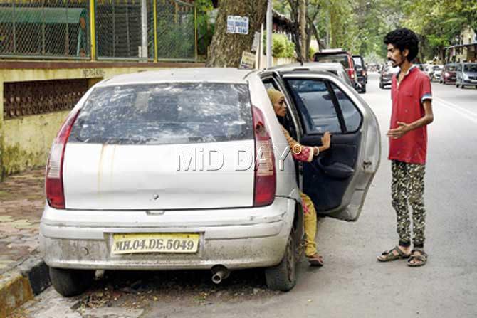 Chanda Rawal with her son Sunny staying in Indica Car from last eight months at Charkop Kandivali. Pic/ Pradeep Dhivar