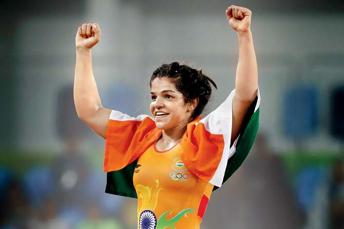 India wrestler Sakshi Malik celebrates after winning bronze in the 58 kg category at the Rio Olympics recently. Pic/AFP