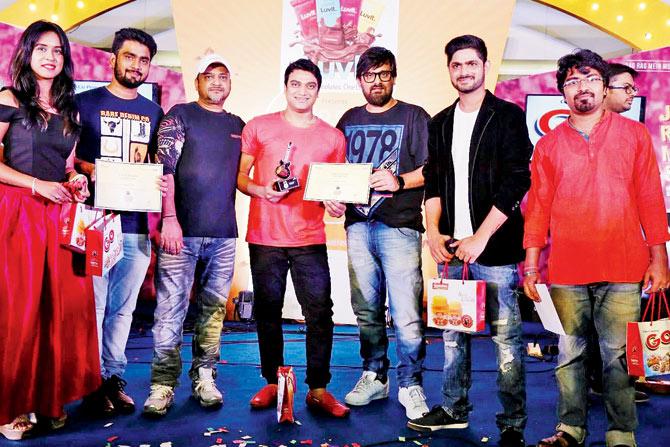 Music director duo Sajid (third from left) and Wajid (third from right) with Radio City Super Singer Season 8 finalists