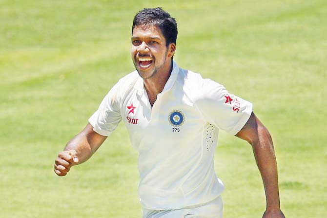 Varun Aaron celebrates a wicket in the Brisbane Test during  India’s 2014-15 tour of Australia. PIC/Getty Images 