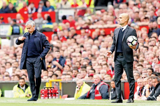 United manager Jose Mourinho (left) and City manager Pep Guardiola on the touchline during their EPL match on Saturday. Pic/AP