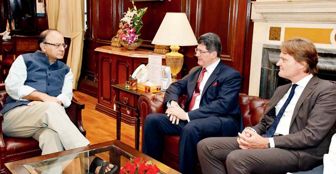 Finance Minister Arun Jaitley (left) speaks to World Bank Managing Director and Chief Financial Officer Brazil’s Joaquim Levy (centre) in New Delhi. Pic/AFP