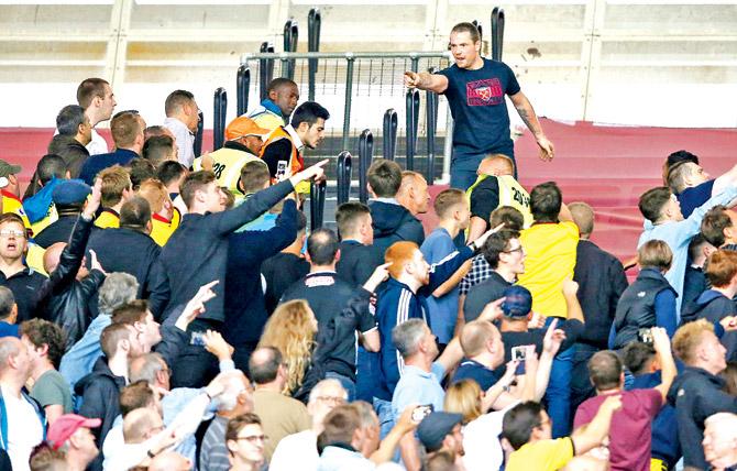 West Ham fans clash among themselves during the Premier League match against Watford in London on Saturday. Pic/AFP