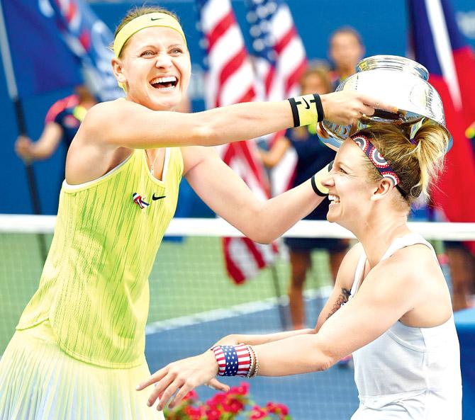 Lucie Safarova (left) and Bethanie Mattek-Sands are jubilant after winning the doubles title. Pic/AFP