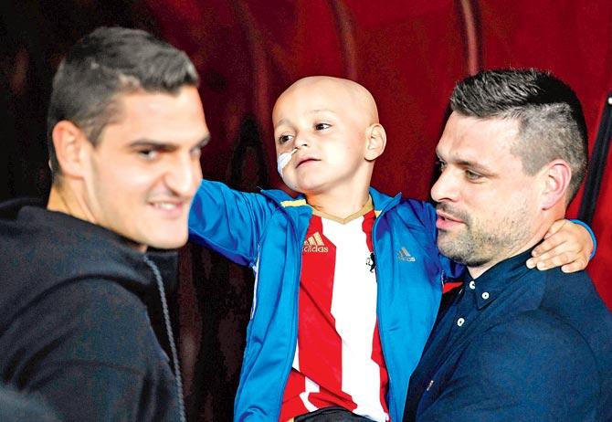Bradley Lowery with his father Carl. Pic/Getty Images 
