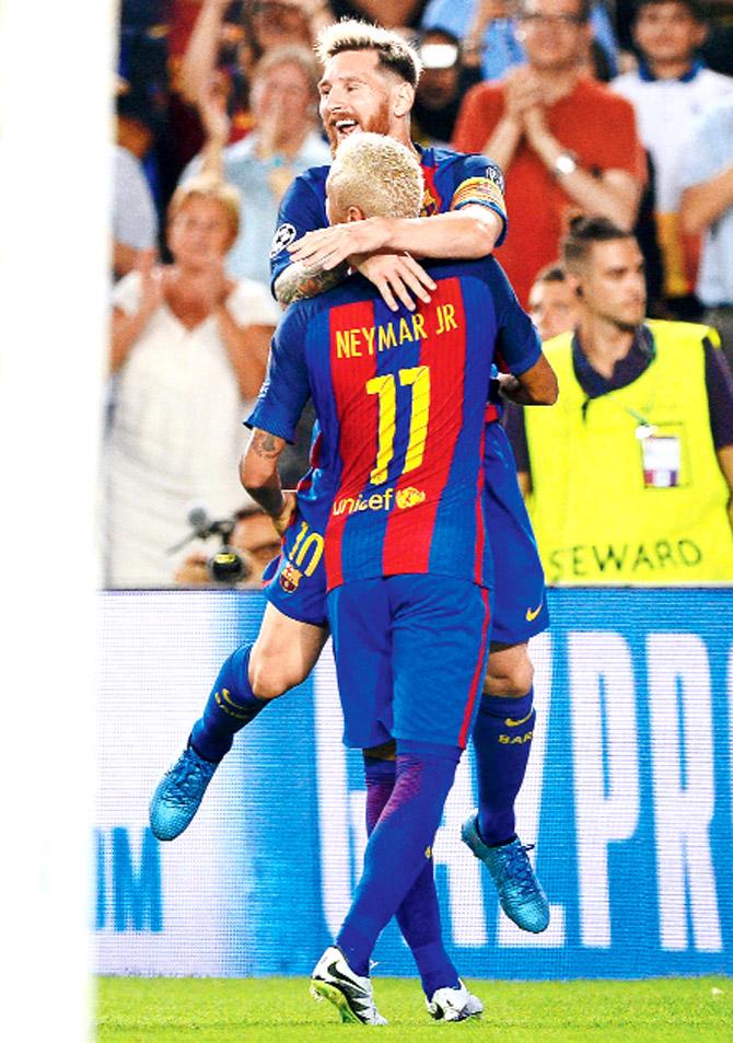 Barcelona forward Lionel Messi celebrates a goal with teammate Neymar during the Champions League match against Celtic at Camp Nou in Barcelona on Tuesday. Pic/AFP