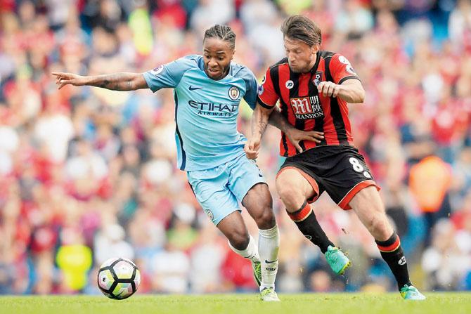 City’s Raheem Sterling (left) and AFC Bournemouth’s Harry Arter battle for possession on Saturday. Pic/Getty Images