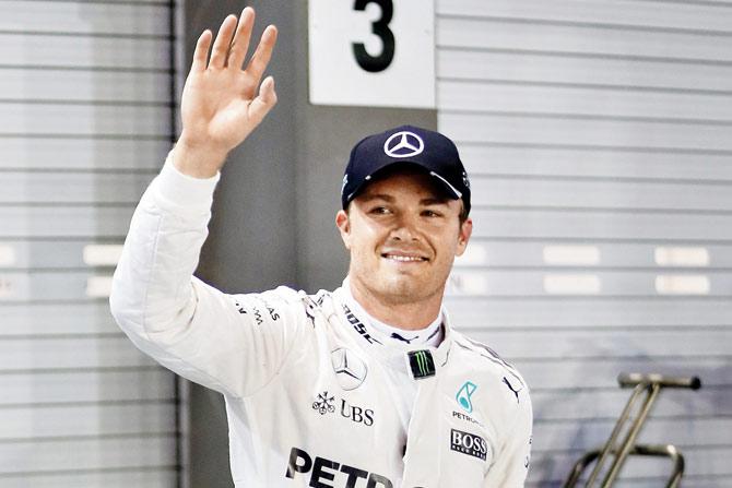 Nico Rosberg celebrates after taking pole position in Singapore on Saturday. Pic/Getty Images