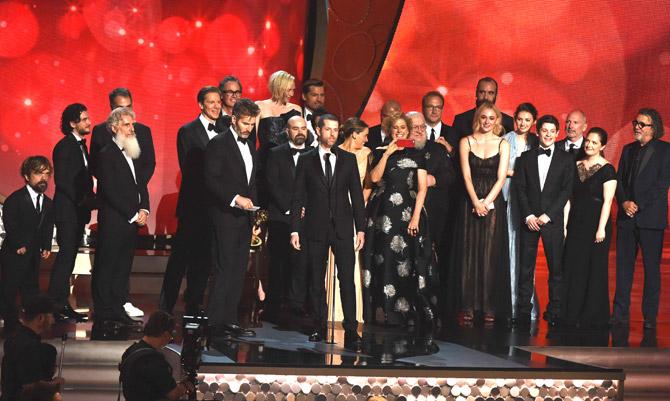 Writer/producers David Benioff (center L), and D.B. Weiss (center R) with cast and crew accept the award for Outstanding Drama Series for 