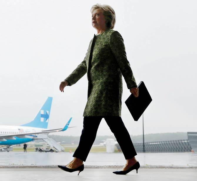 Hillary Clinton walks to a podium to speak at a rally. Pic/AP