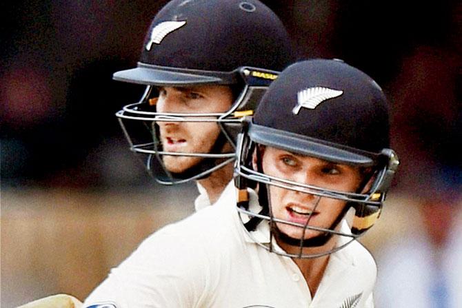 New Zealand’s Latham (right) and Williamson complete a run on the second day yesterday. Pic/PTI