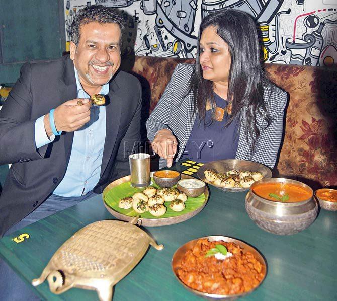 Nityanand Shetty and wife Seema relish a plateful of the latter’s Sunday specialty, gulliyappas. Pics/Sameer Markande