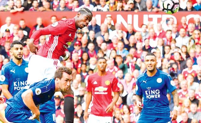 Paul Pogba heads in Manchester United