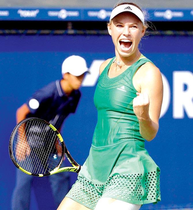 Wozniacki celebrates after beating Osaka in the Pan Pacific Open final in Tokyo yesterday. Pic/AP,PTI