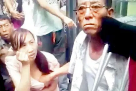 This 'mystic man' claims he can tell lady's fortune by touching her breast