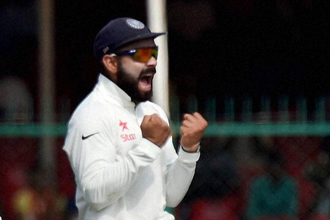 India skipper Virat Kohli celebrates fall of a New Zealand wicket during India