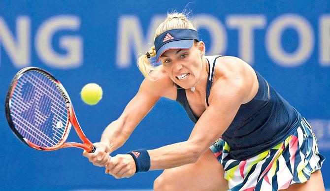 German Angelique Kerber returns during her second round match against France’s Kristina Mladenovic in Wuhan yesterday. Pic/AFP