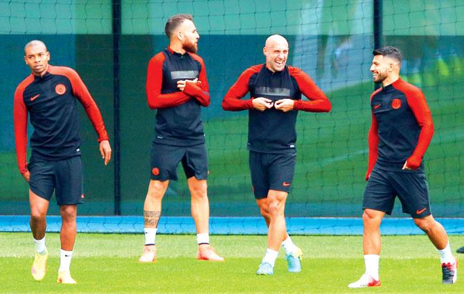 Manchester City midfielder Fernandinho (extreme left) with his teammates Nicolas Otamendi (second from left), Pablo Zabaleta (centre) and Sergio Aguero during a training session at City Academy in Manchester yesterday. Pic/Getty Images