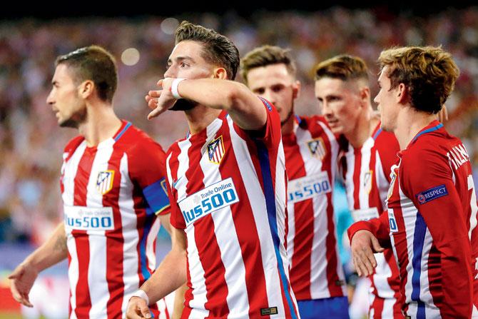 Midfielder Yannick Carrasco (centre) exults after scoring Atletico Madrid’s only goal against Bayern Munich during the Champions League encounter at Vicente Calderon Stadium in Madrid on Wednesday. Pic/AP
