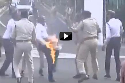 Watch video: Man tries to immolate himself in front of minister's convoy