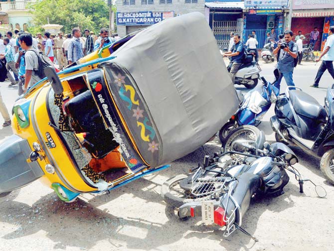 An autorickshaw and two-wheelers which were vandalised by prote­s­ters on Friday. Pics/PTI