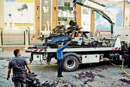 Bombings near Baghdad mall kill at least 13 people