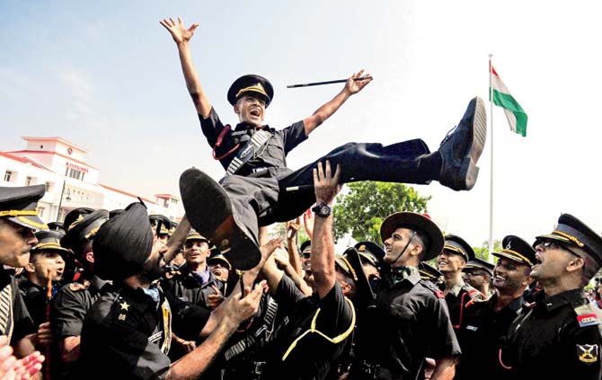 Cadets celebrate during their graduation ceremony at the Officer Training Academy in Chennai on Saturday
