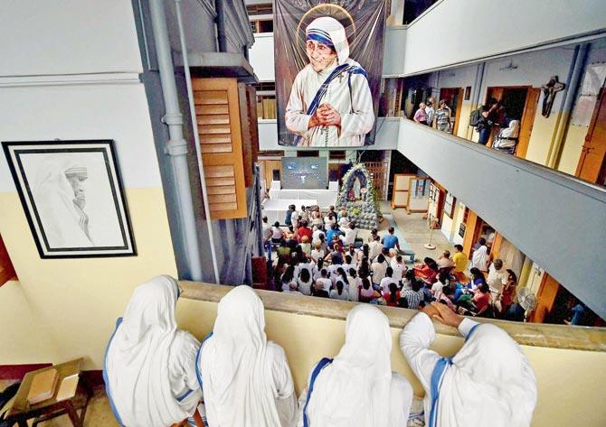 Nuns of Missionaries of Charity watch the live telecast in Kolkata. Pic/PTI